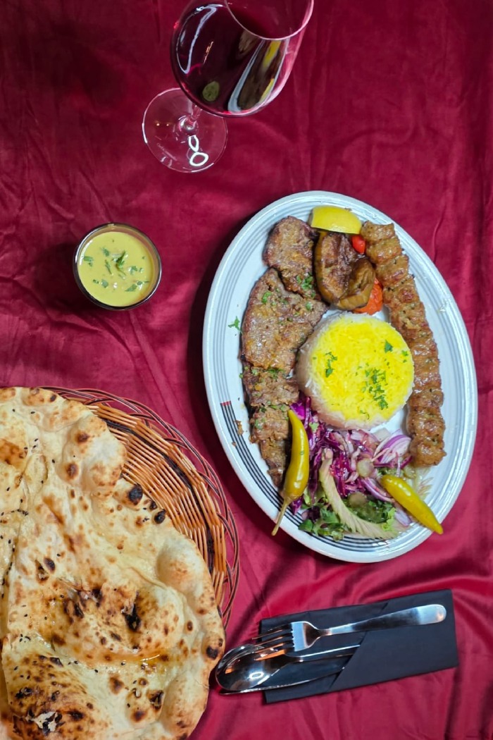 Ziba Restaurant’s Soltani Kebab with a mound of saffron rice, salad, and flatbread in 
Dunfermline. 