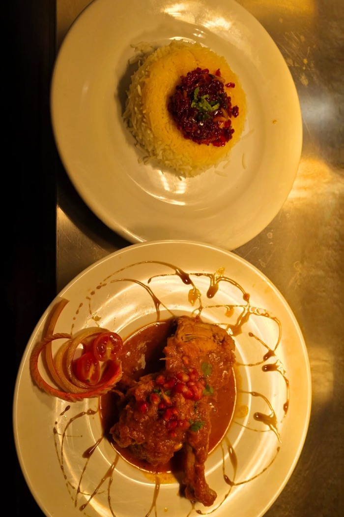 Ziba Restaurant’s Saffron rice topped with bright, jeweled barberries, served alongside a piece 
of chicken in Dunfermline.